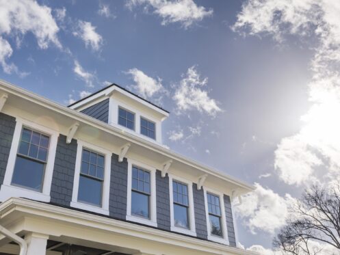 Sunny day illuminating a house with many windows
